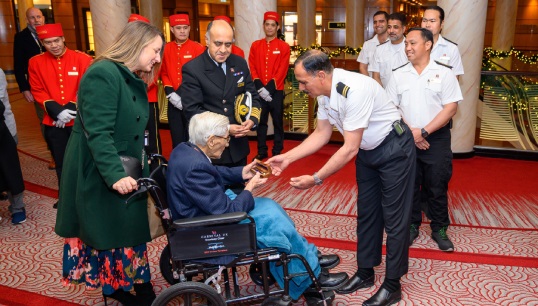 Queen Mary 2's bosun presenting his 102-year-old wartime counterpart John Davies with a brass bosun's whistle. Image: Cunard Line Image: Queen Mary 2's bosun presenting his 102-year-old wartime counterpart John Davies with a brass bosun's whistle. Image: Cunard Line